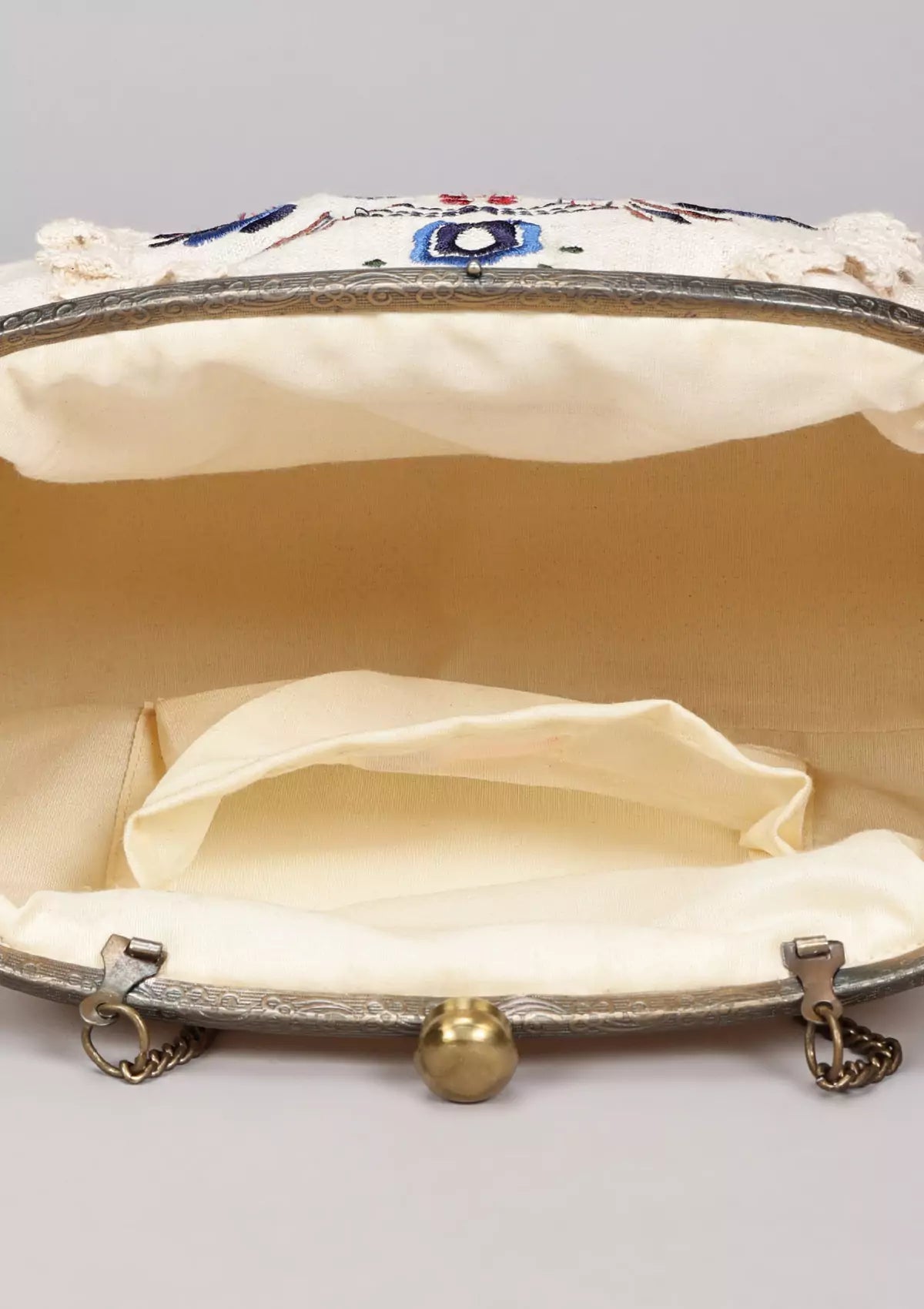 Beige handheld clutch and sling bag Price