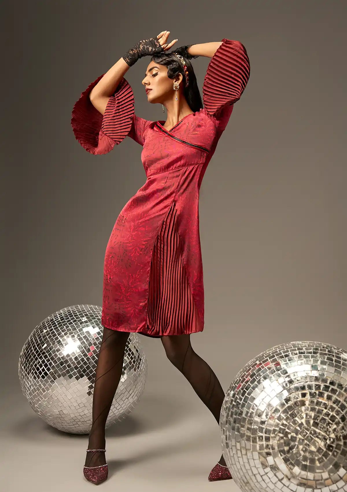 lush pleated dress Twirl-worthy elegance This lush floral jacquard dress stuns with its sculptural silhouette, pleated flare, and dynamic high-low hemmade to catch the light and every eye. Bonus: it has pockets. #