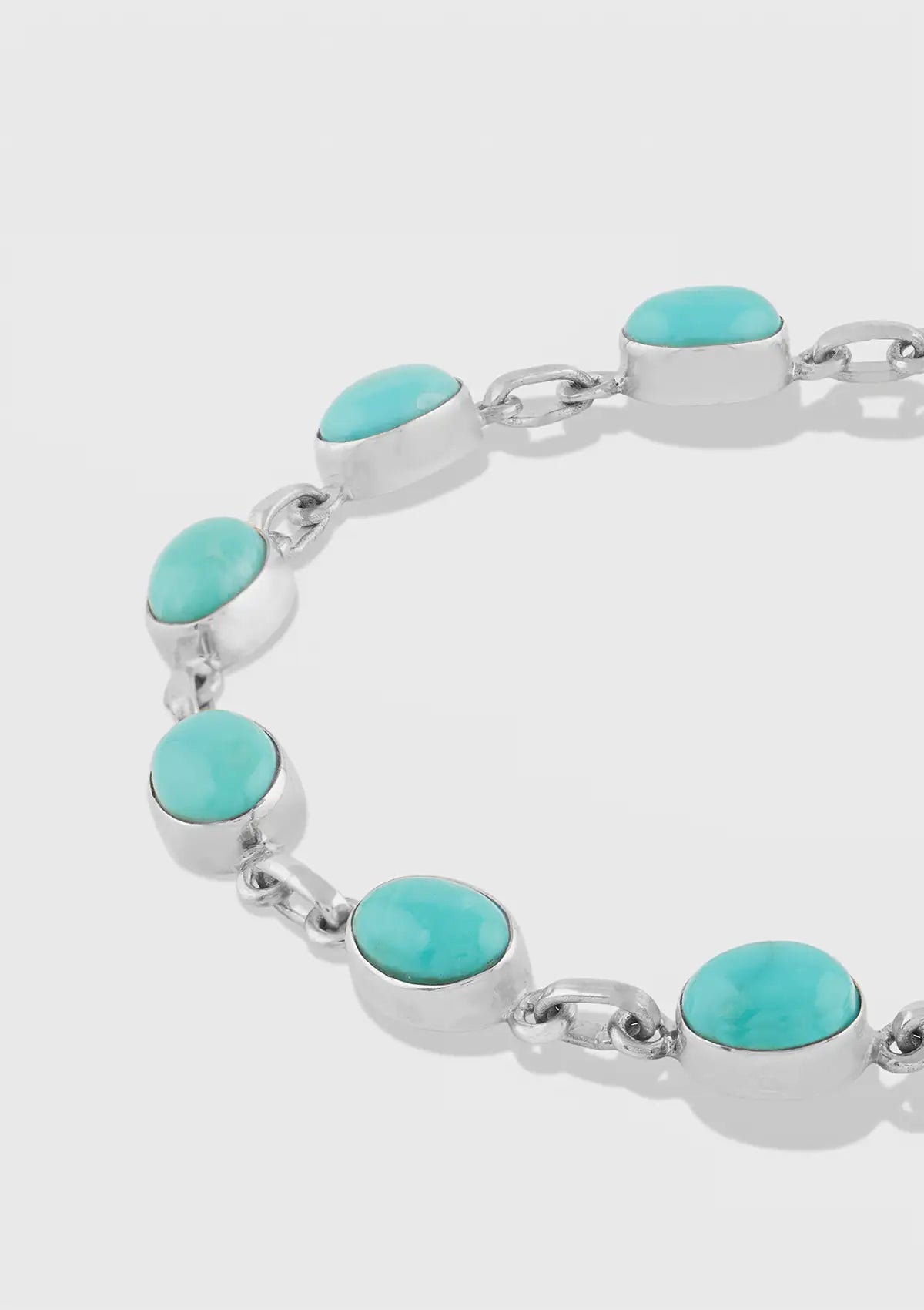 Silver Bracelet studded with Turquoise Gemstones