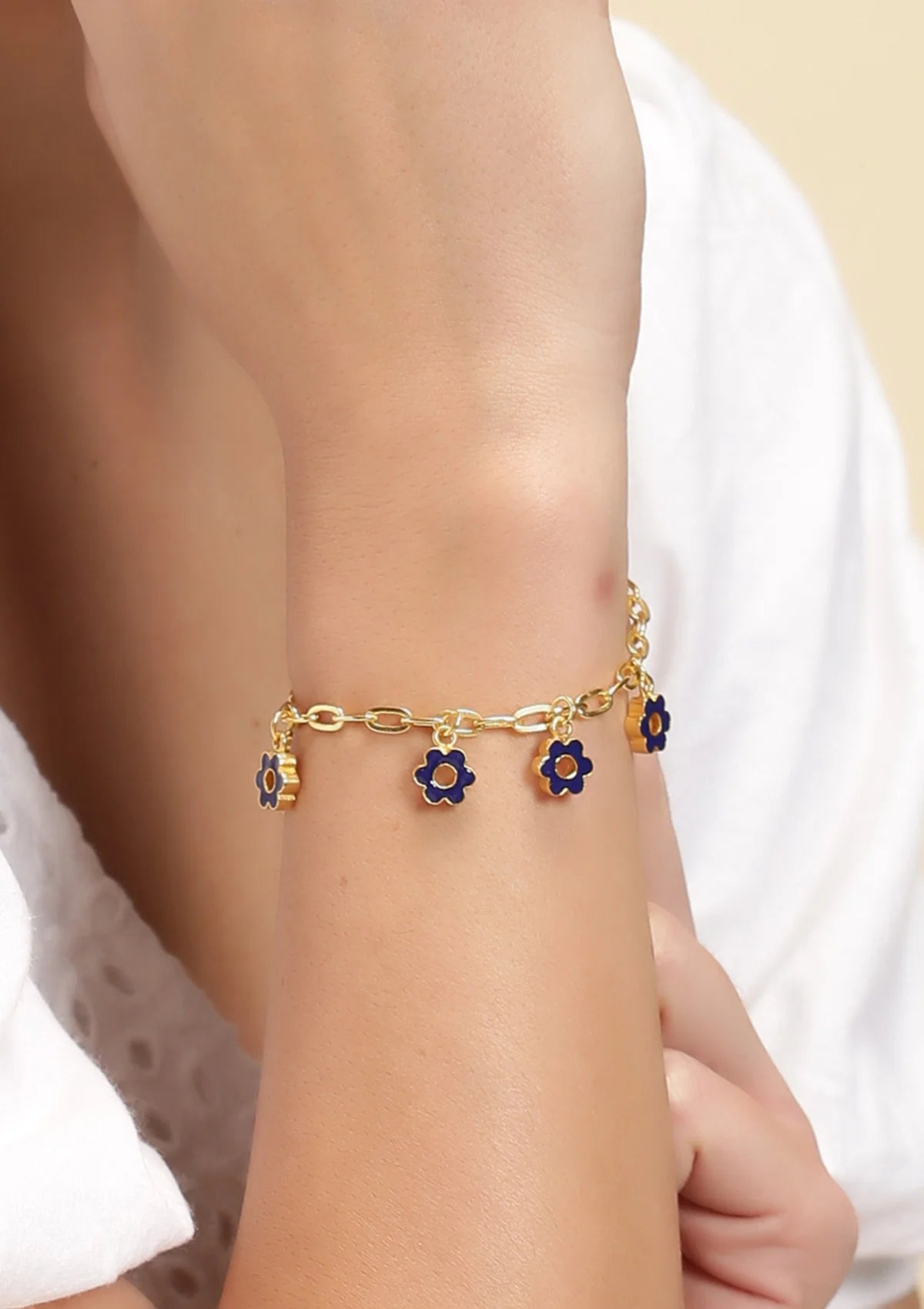 Buy Women's gold plated blue flower charm bracelet online