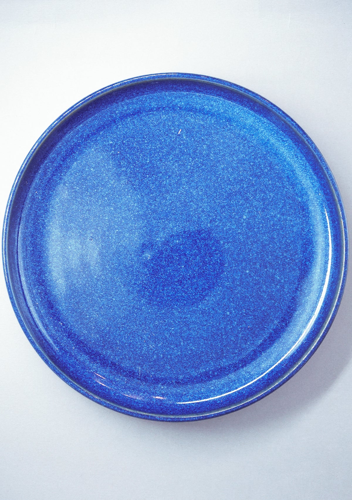 Deep blue ceramic dining set with decor vase