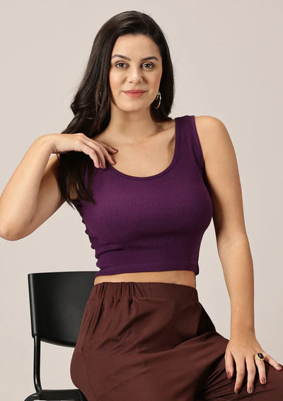 Model showcasing purple ribbed sleeveless crop top paired with mocha knit joggers for a comfy casual style