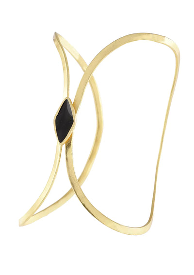 Gold bracelet with a black gemstone on a white background
