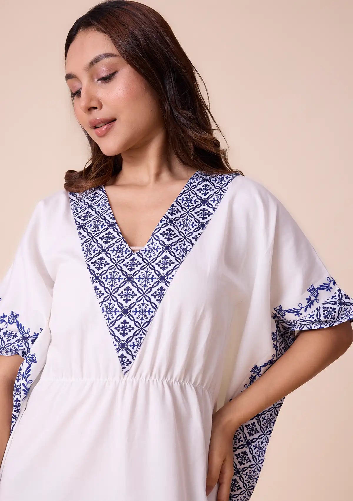 Candela Solid kaftan with printed panel and embroidered hem Price